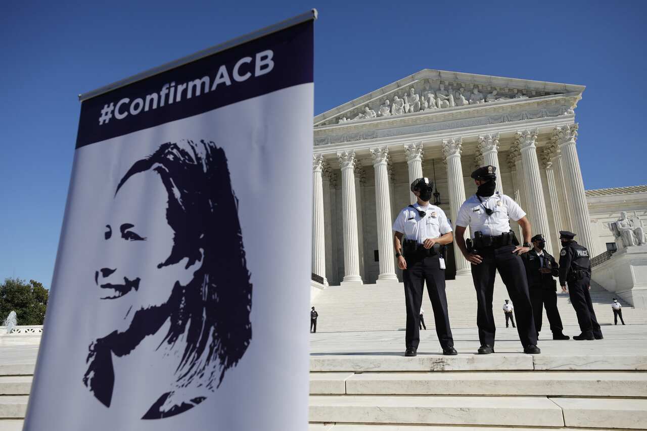 A poster with the Court nominee Judge Amy Coney Barrett is seen outside U.S. Supreme Court during the 2020 Women's March in Washington on October 17, 2020. Photo by Yuri Gripas/ABACAPRESS.COM.