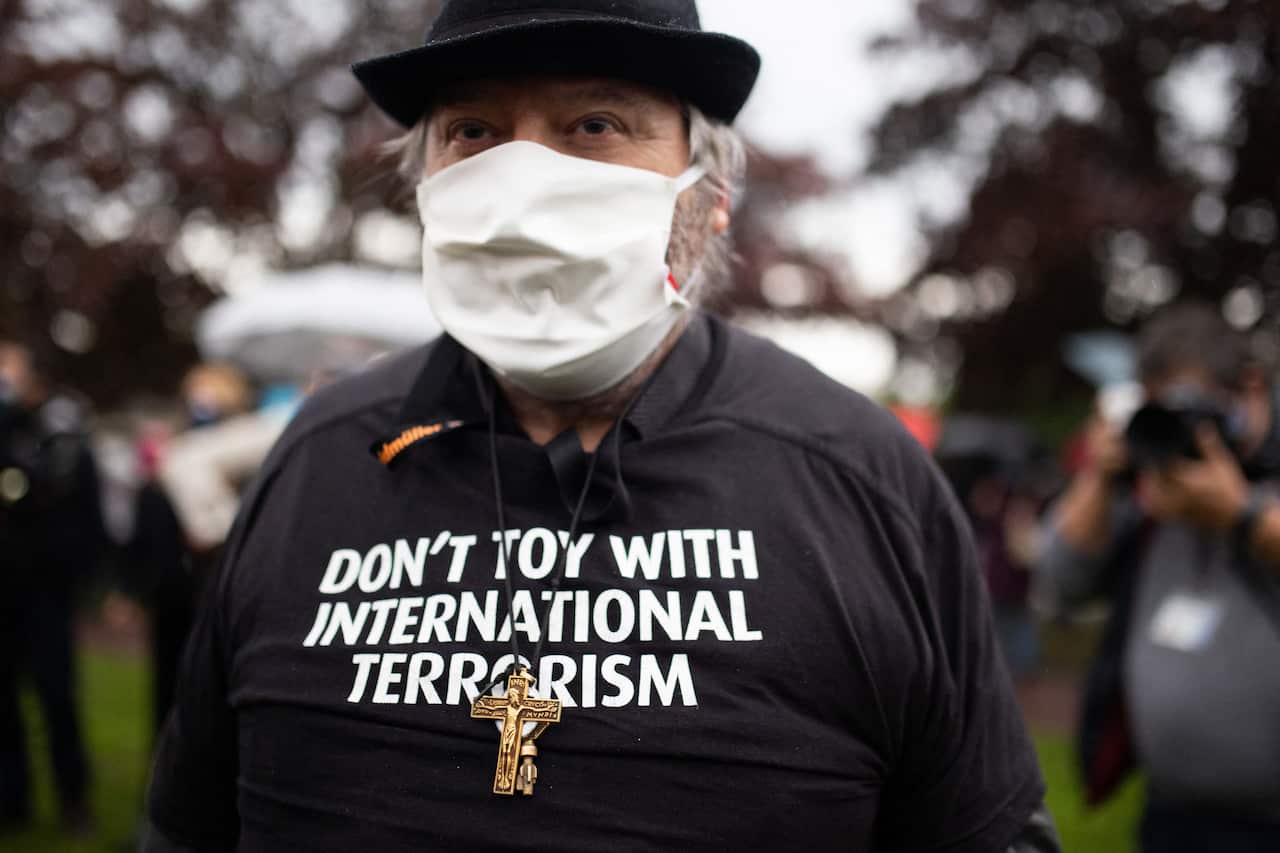 People wearing a shirt Don't toy with international terrorism gather at the middle school in Conflans-Sainte-Honorine, northwest of Paris, on 20 October, 2020.