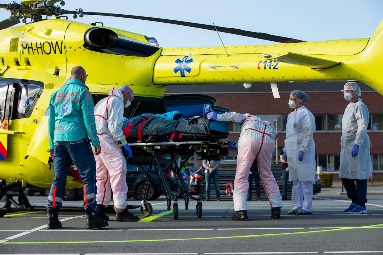 A COVID-19 patient is being carried into a helicopter at Flevoziekenhuis, or Flevo Hospital, in Almere, Netherlands.