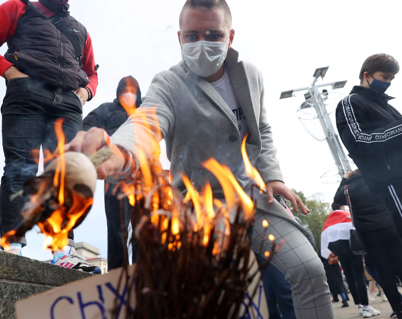 A Belarusian opposition supporter takes part in a rally in central Minsk.