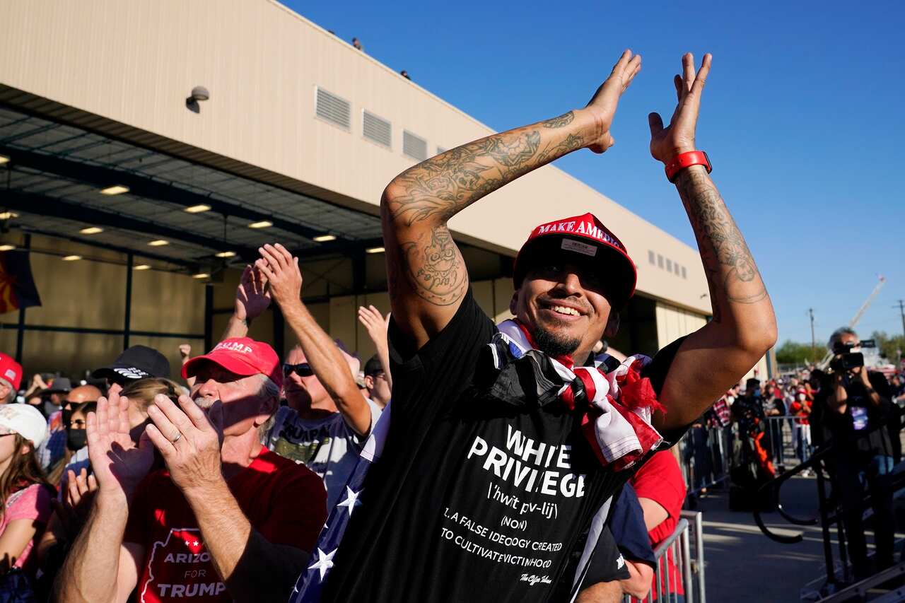 Supporters applaud President Donald Trump as he speaks at a campaign rally at Phoenix Goodyear Airport Wednesday, Oct. 28, 2020, in Goodyear, Ariz. (AP Photo/Ross D. Franklin)