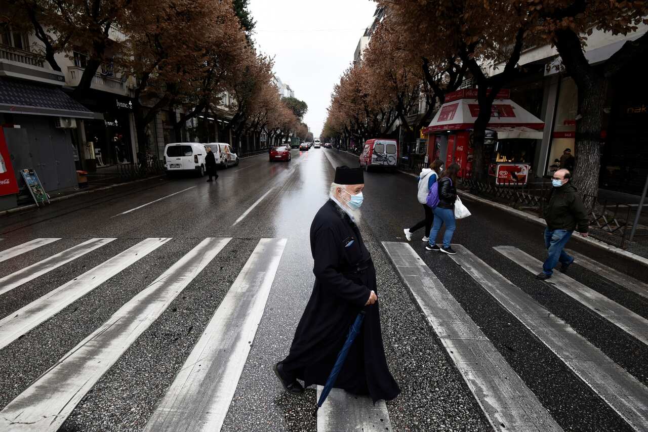 A Greek orthodox priest walking in the main shopping area of Thessaloniki