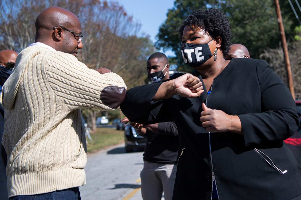 Reverend Raphael Warnock, Democratic candidate for Georgia senate, and Stacey Abrams during a campaign event  in Atlanta, Georgia, 3  November, 2020. 