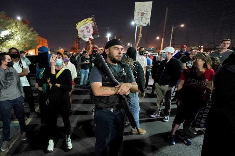 Supporters of Donald Trump rally outside the Maricopa County Recorder's Office, Wednesday, Nov. 4, 2020