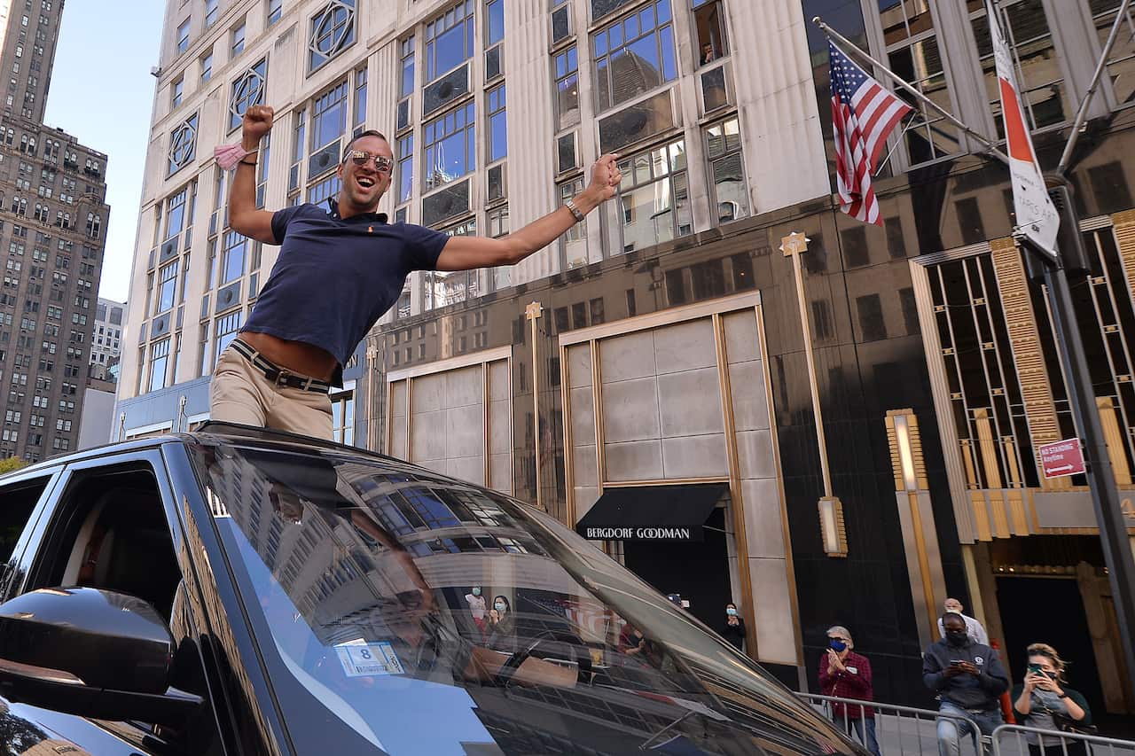 People celebrate across the street from Trump Tower in New York. 