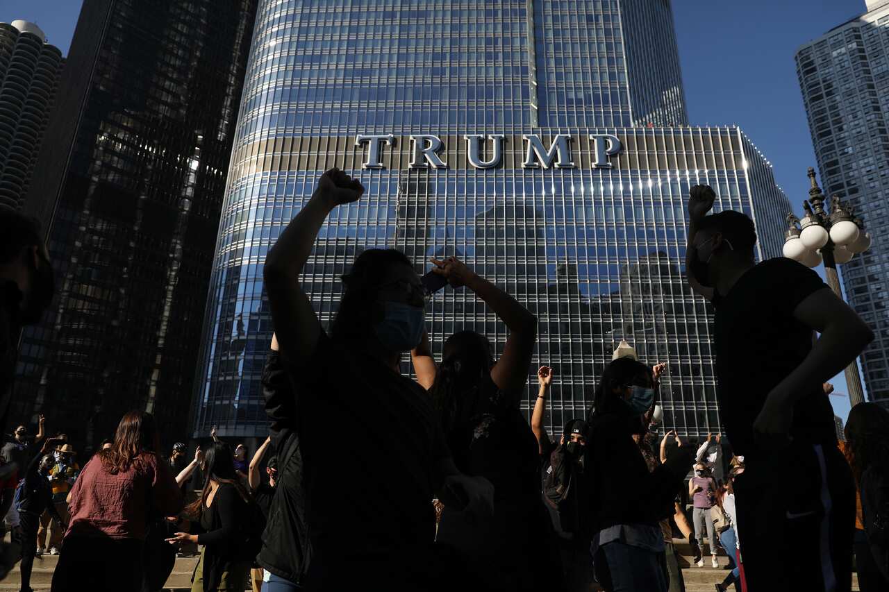 Supporters celebrate near Trump International Hotel & Tower in Chicago on Saturday, 7 November, 2020. 