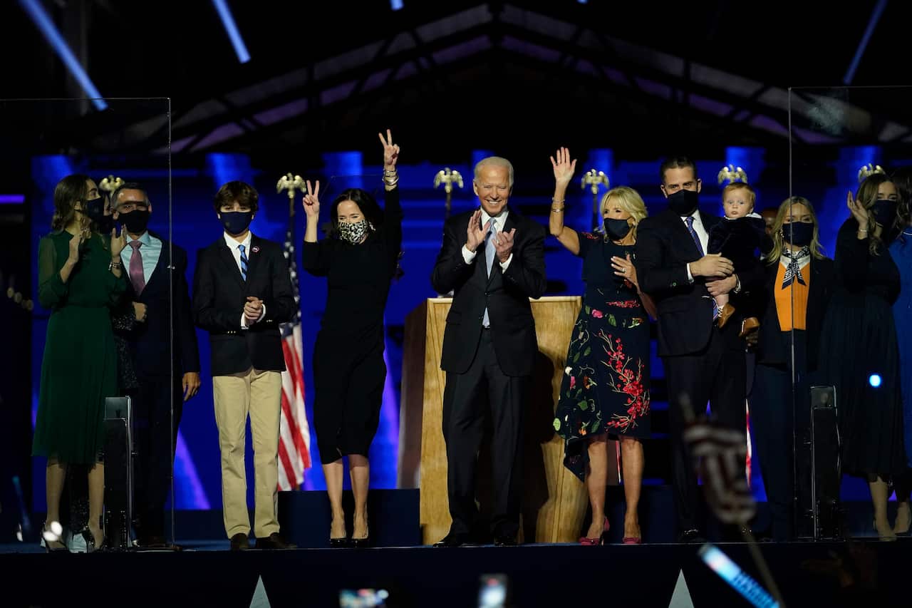 The Biden family waves to supporters. 