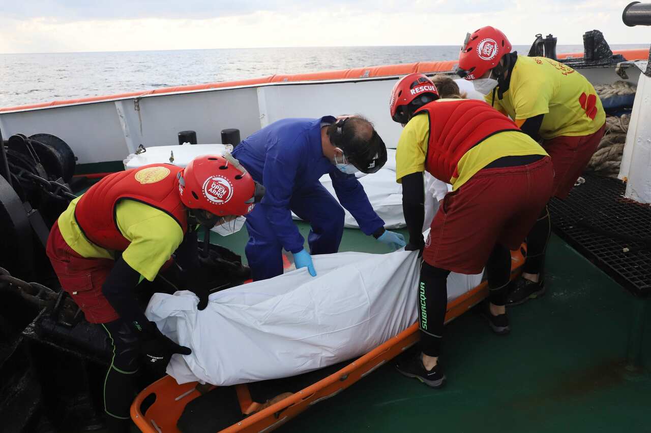 NGO Proactiva Open Arms members recover a dead body of a migrant in the Mediterranean Sea