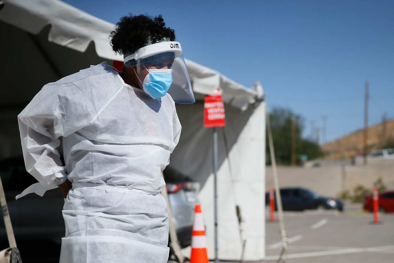 A medical worker at a COVID-19 drive-thru testing site in El Paso, Texas.