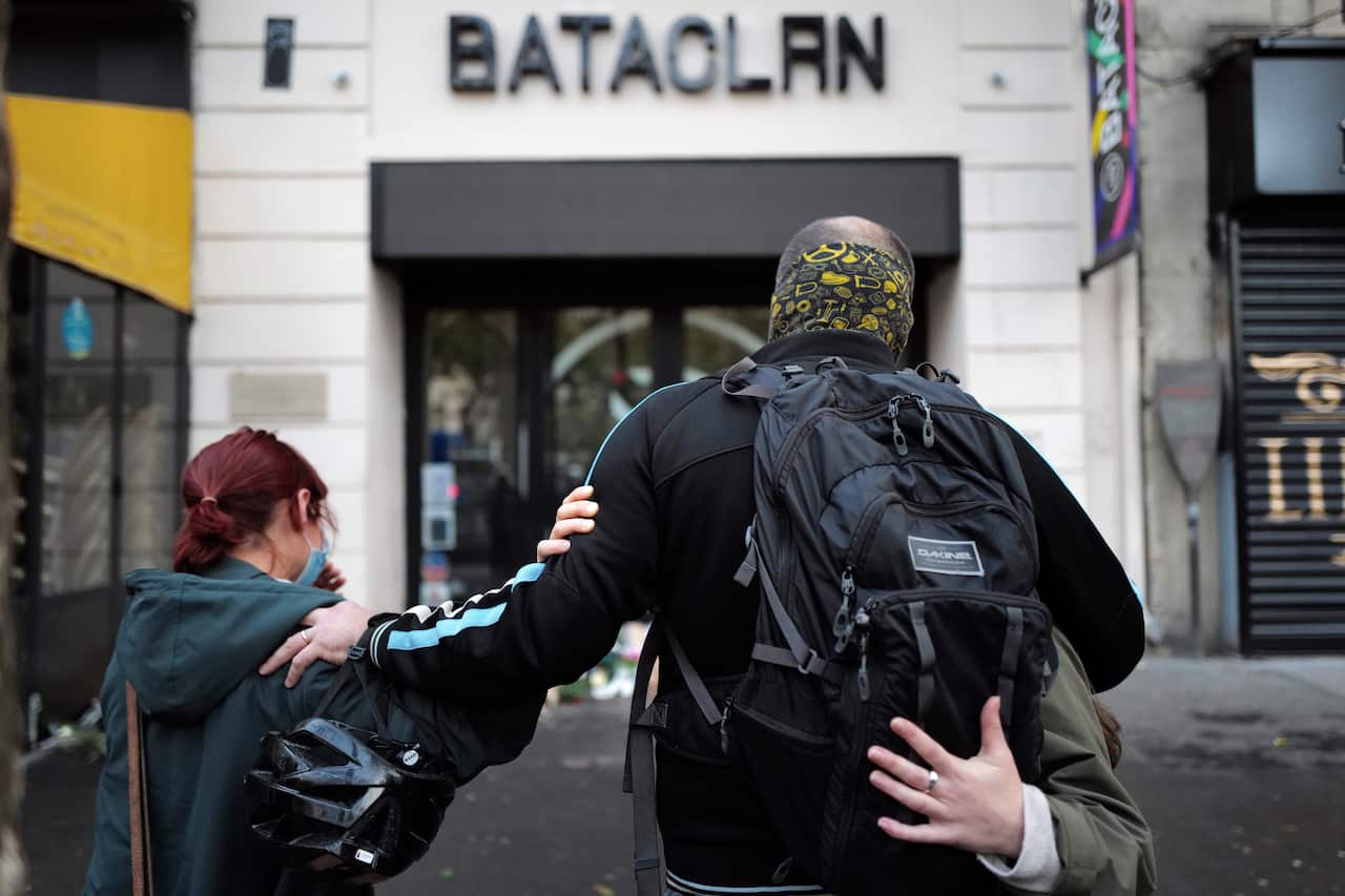 Relatives pay their respects outside the Bataclan concert hall marking the 5th anniversary of the Paris attacks.