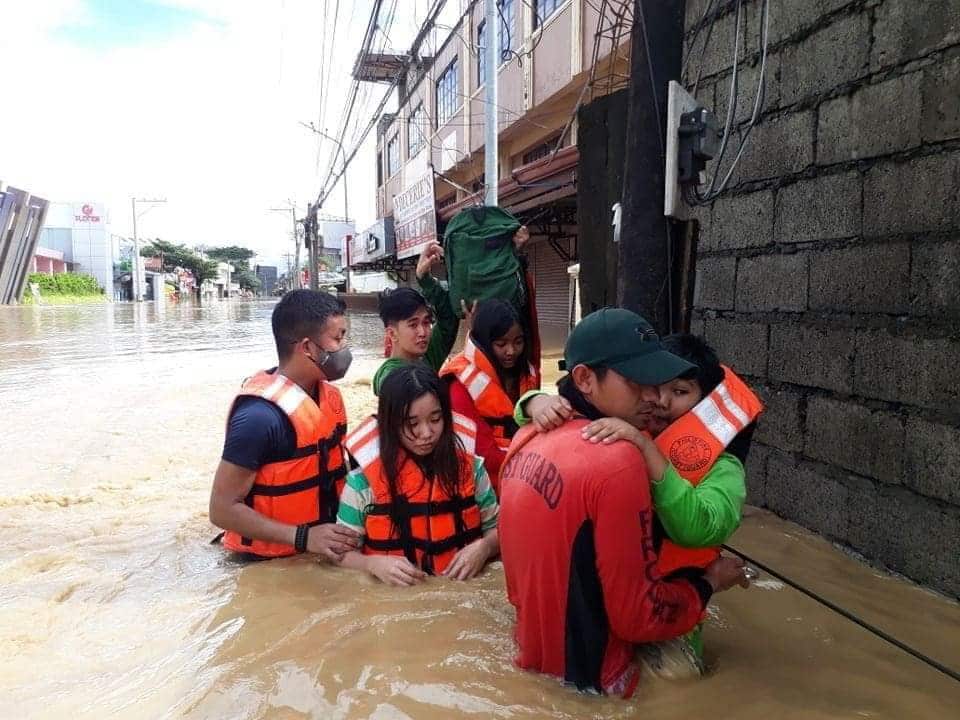 Members of the coast guard assisting residents following the aftermath of typhoon Vamco in Cagayan region