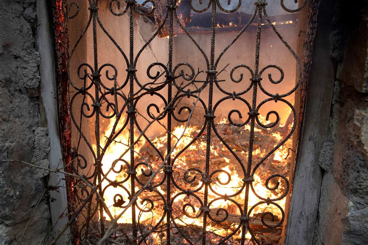 A burning house left by residents in the village of Chorekdar, November 14, 2020.