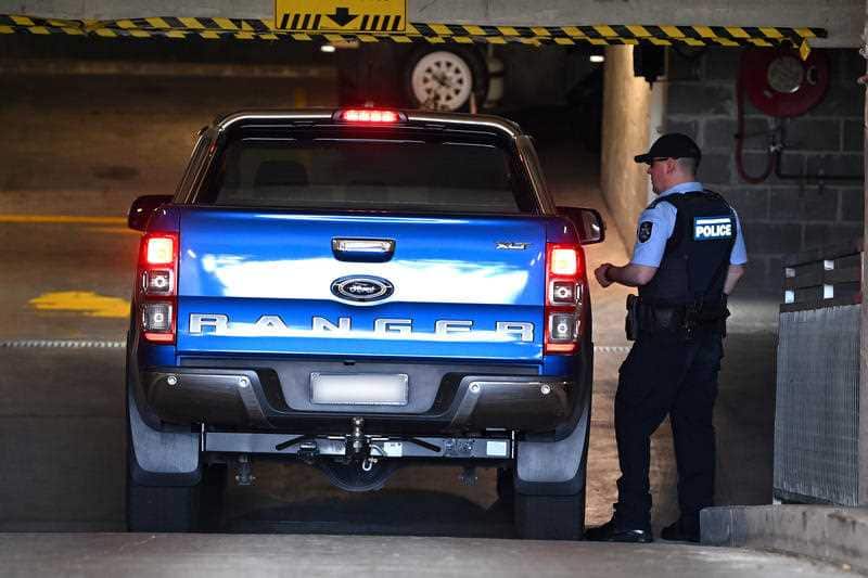 Australian Federal Police officers are seen at the CFMEU offices in Sydney on 18 November. 