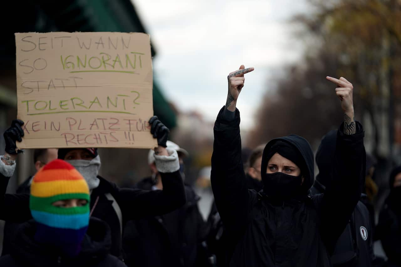 Counter protesters shown during a demonstration against German coronavirus restrictions in Berlin on 22 November.