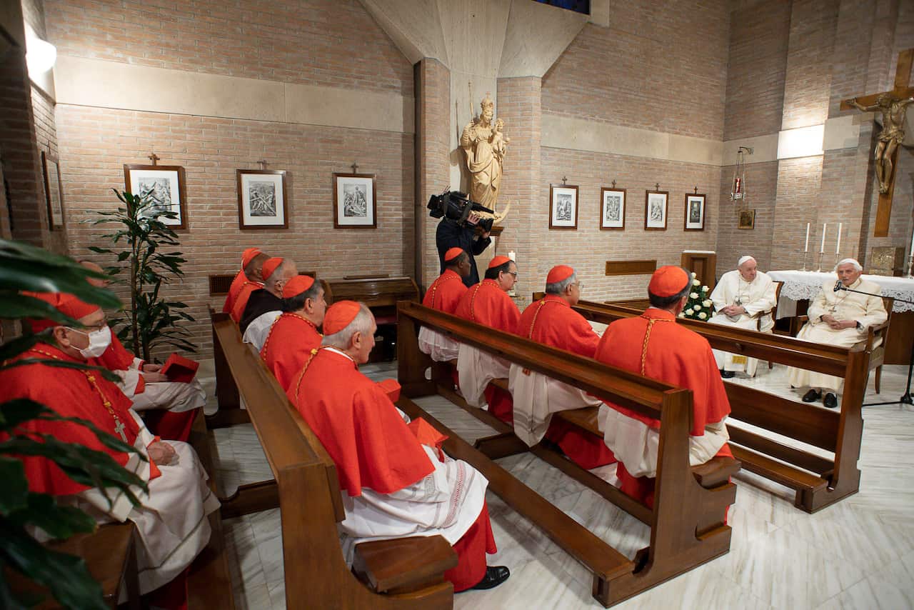 Pope Francis with Pope Emeritus Benedict XVI with the newly elevated cardinals at the Vatican.