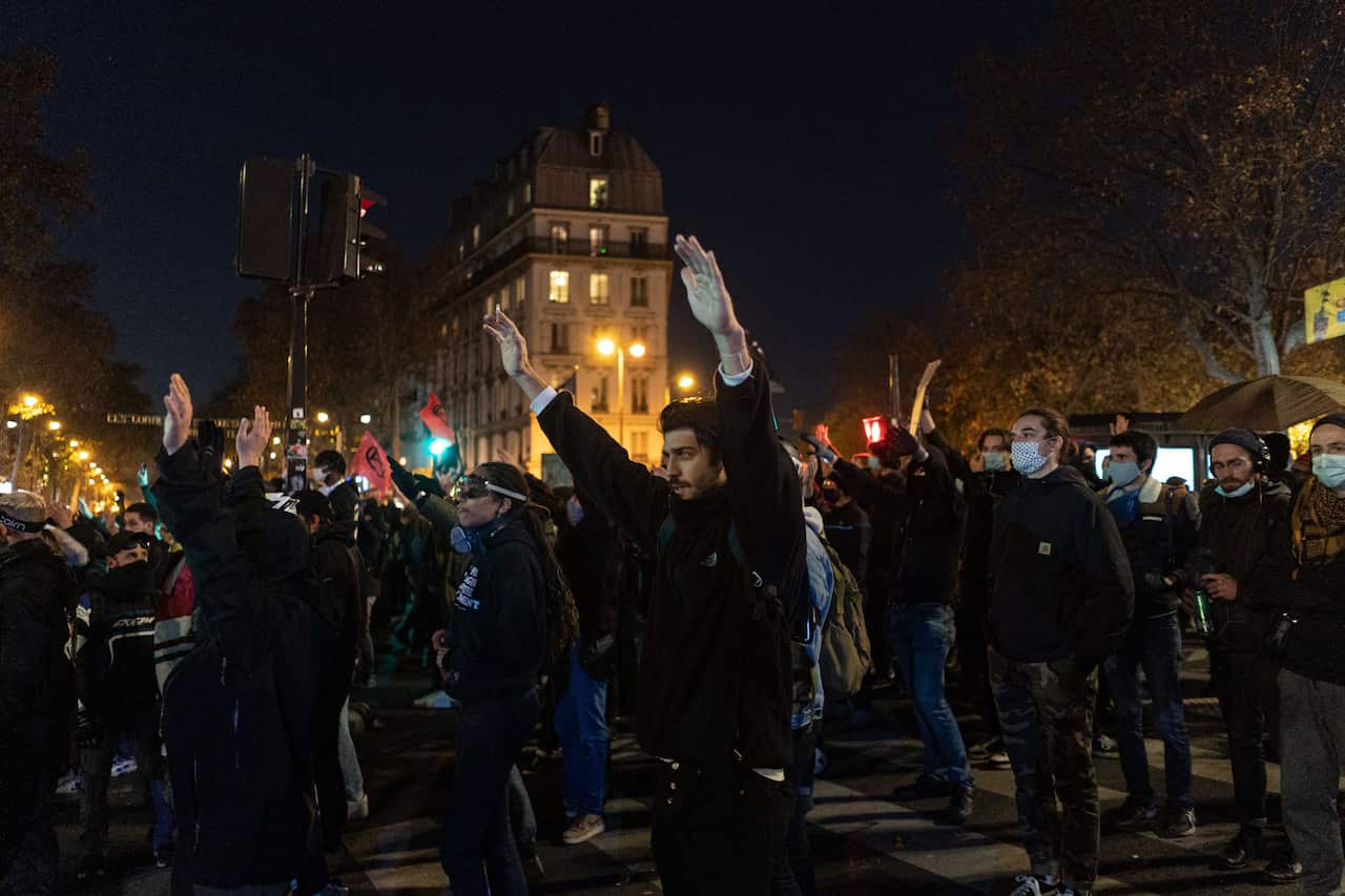 Demonstrators attend a protest against the 'global security' draft law in Paris.