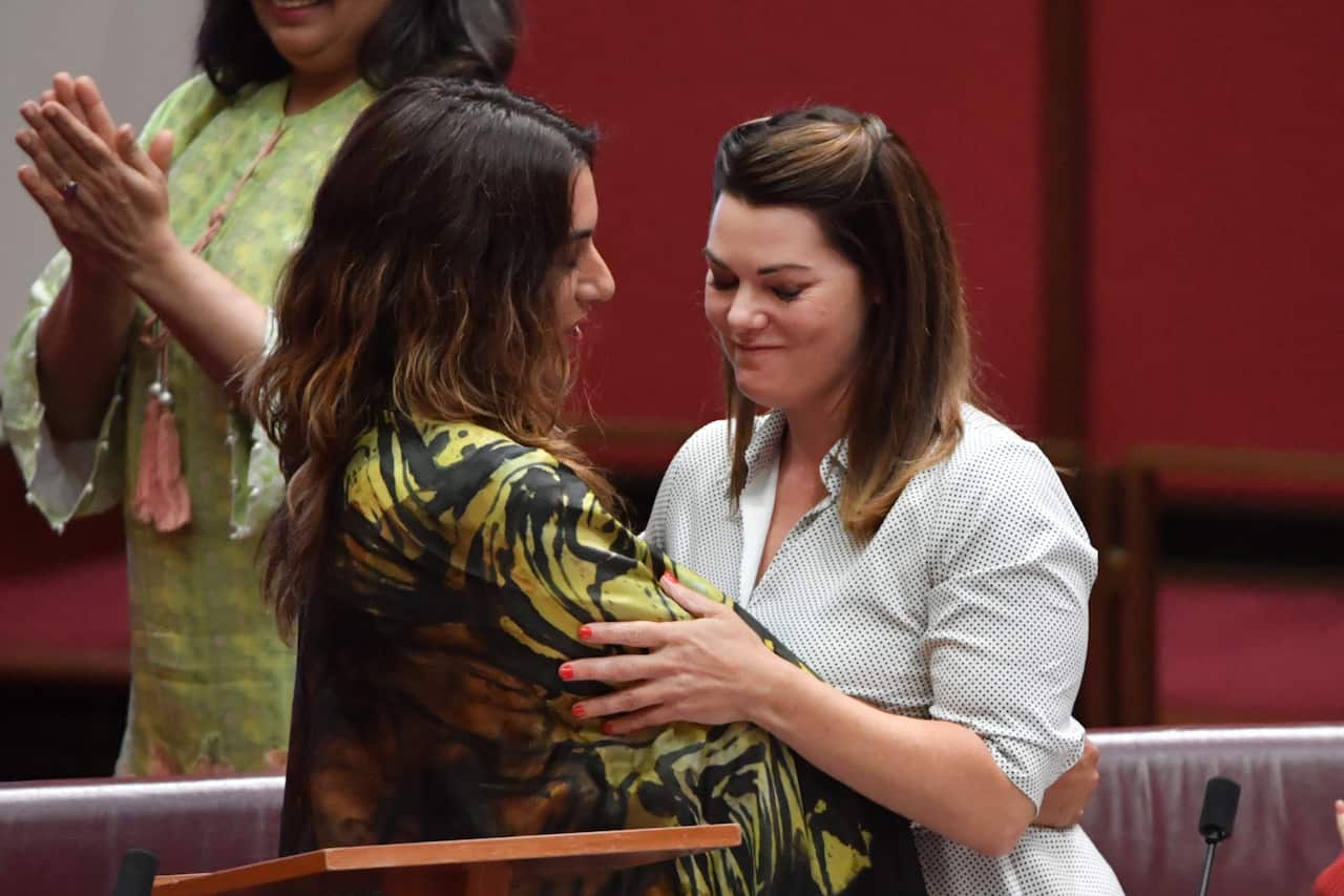Greens Senator Sarah Hanson-Young (R) hugs Greens Senator Lidia Thorpe.