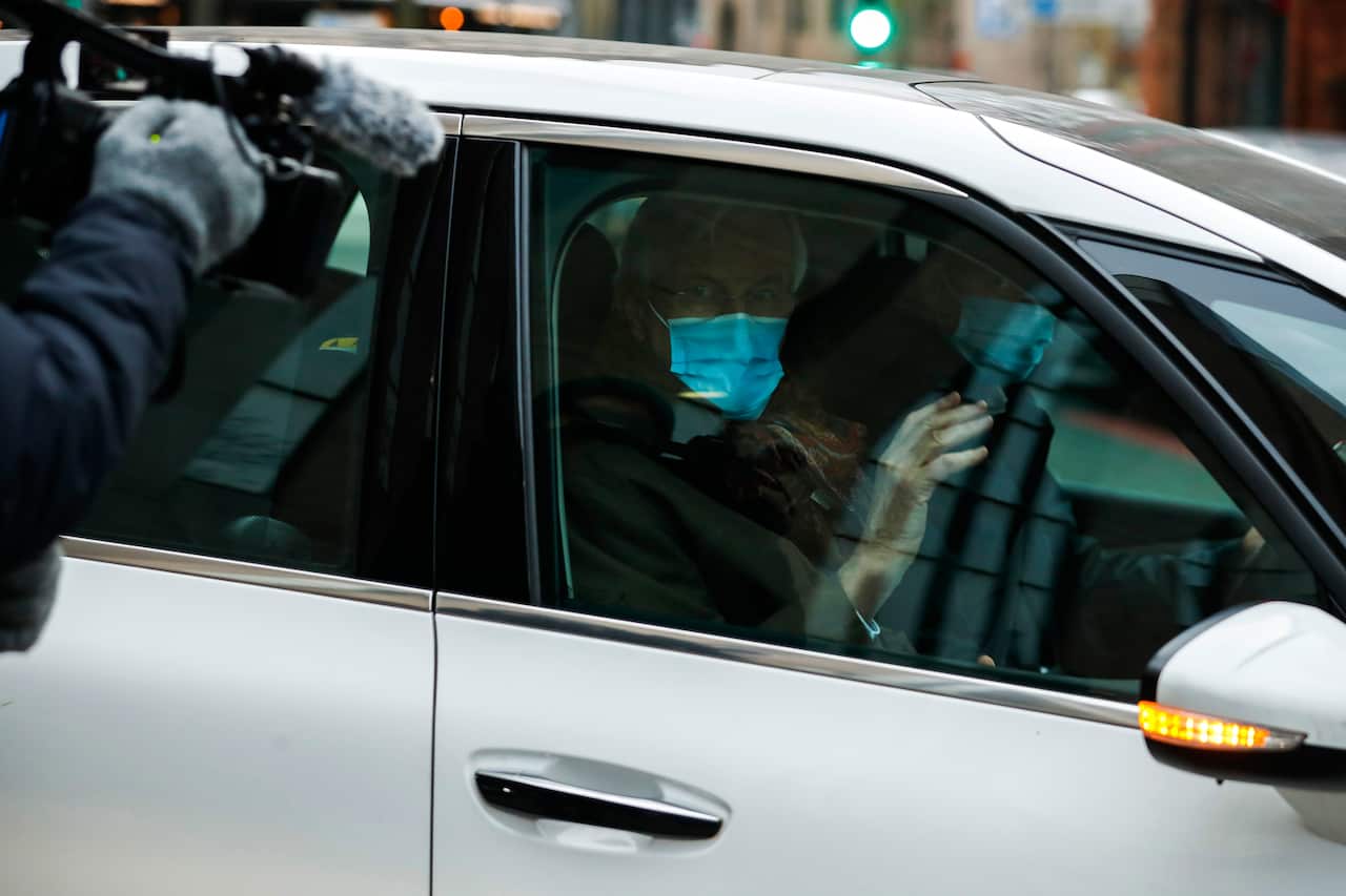 EU chief negotiator Michel Barnier, right, waves as he leaves the EU Borschette building after a meeting with Britain's chief negotiator David Frost.