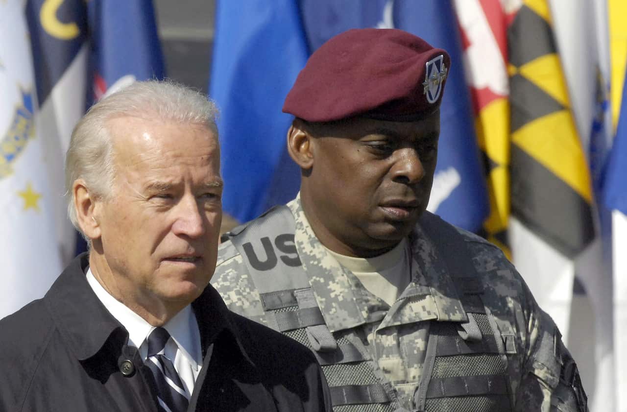An April 2009 photo showing Joe Biden and Lloyd Austin at a ceremony welcoming troops home at Fort Bragg outside Fayetteville, North Carolina 