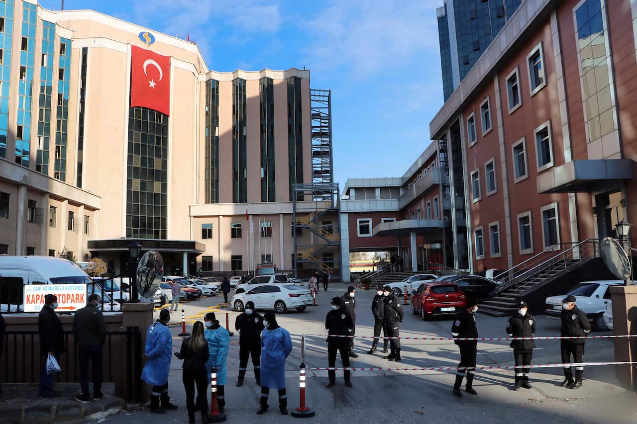 Police and medics gather outside Sanko University Hospital in Gaziantep, 19 December, 2020.