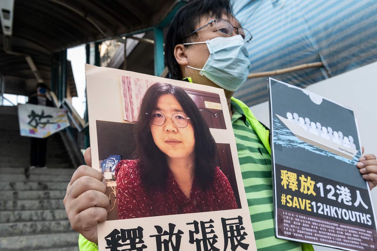 A pro-democracy activist holds up a signs in support of Chinese citizen journalist Zhang Zhan in Hong Kong.