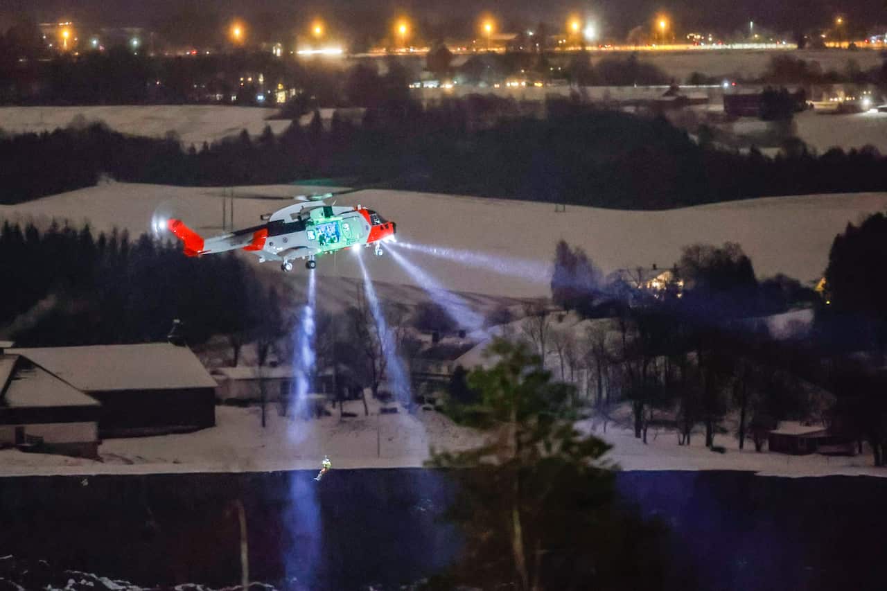 A helicopter near the site where a big landslide hit a residentaial area in Ask.