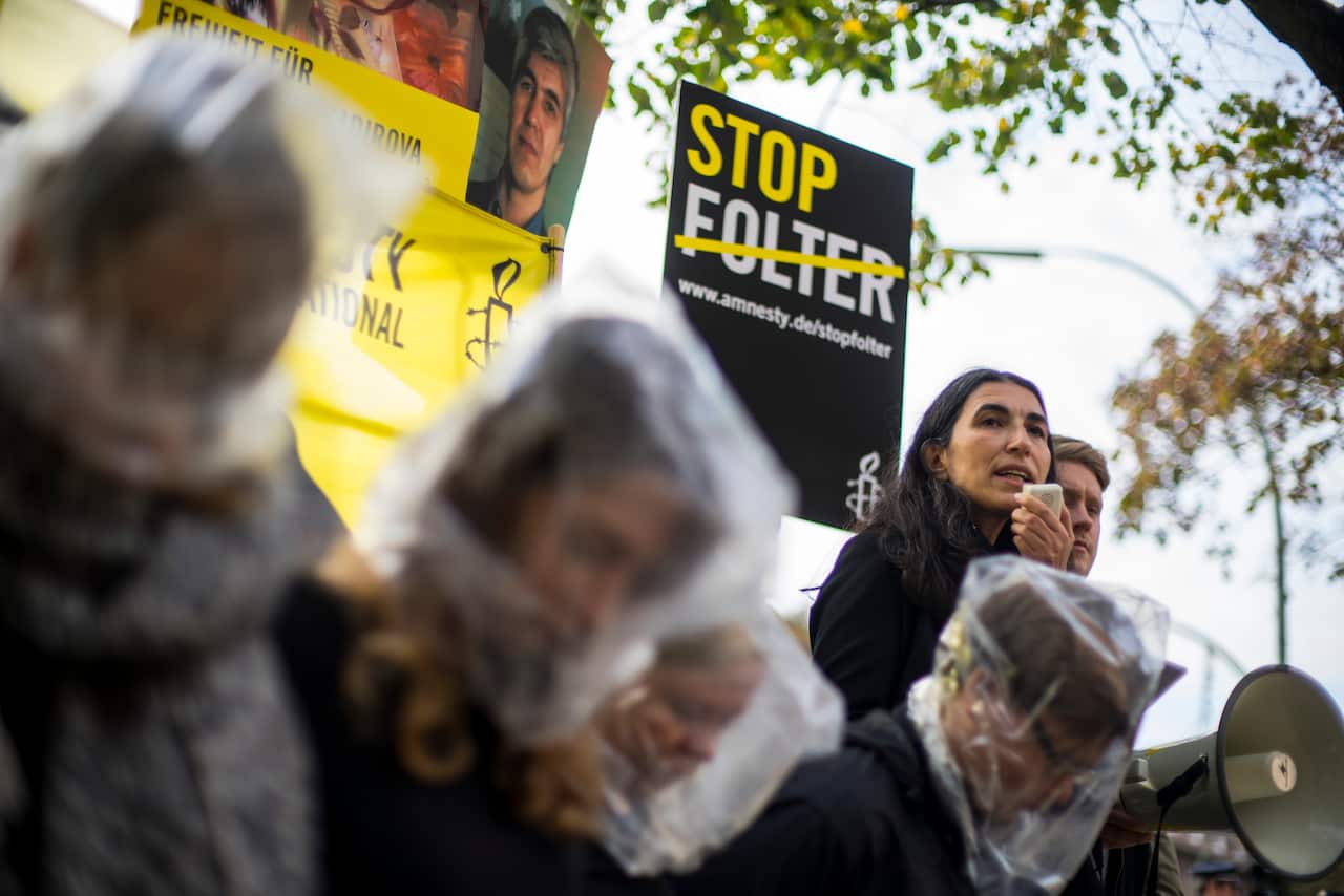 Activists in Berlin rally for the release of Dilorom Abdukadirova. (Amnesty International)
