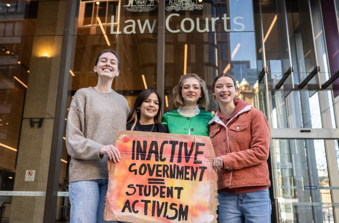 Laura Kirwin, Izzy Raj-Seppings, Ava Princi and Liv Heaton pose for a photo outside The Federal Court of Australia in Sydney, Thursday, May 27, 2021