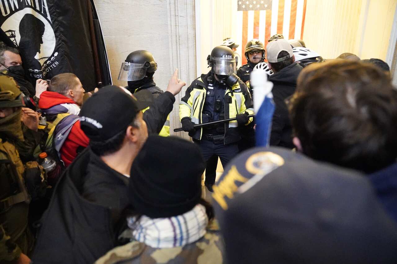 Protestors enter the Capitol building during a joint session of Congress in Washington, DC.