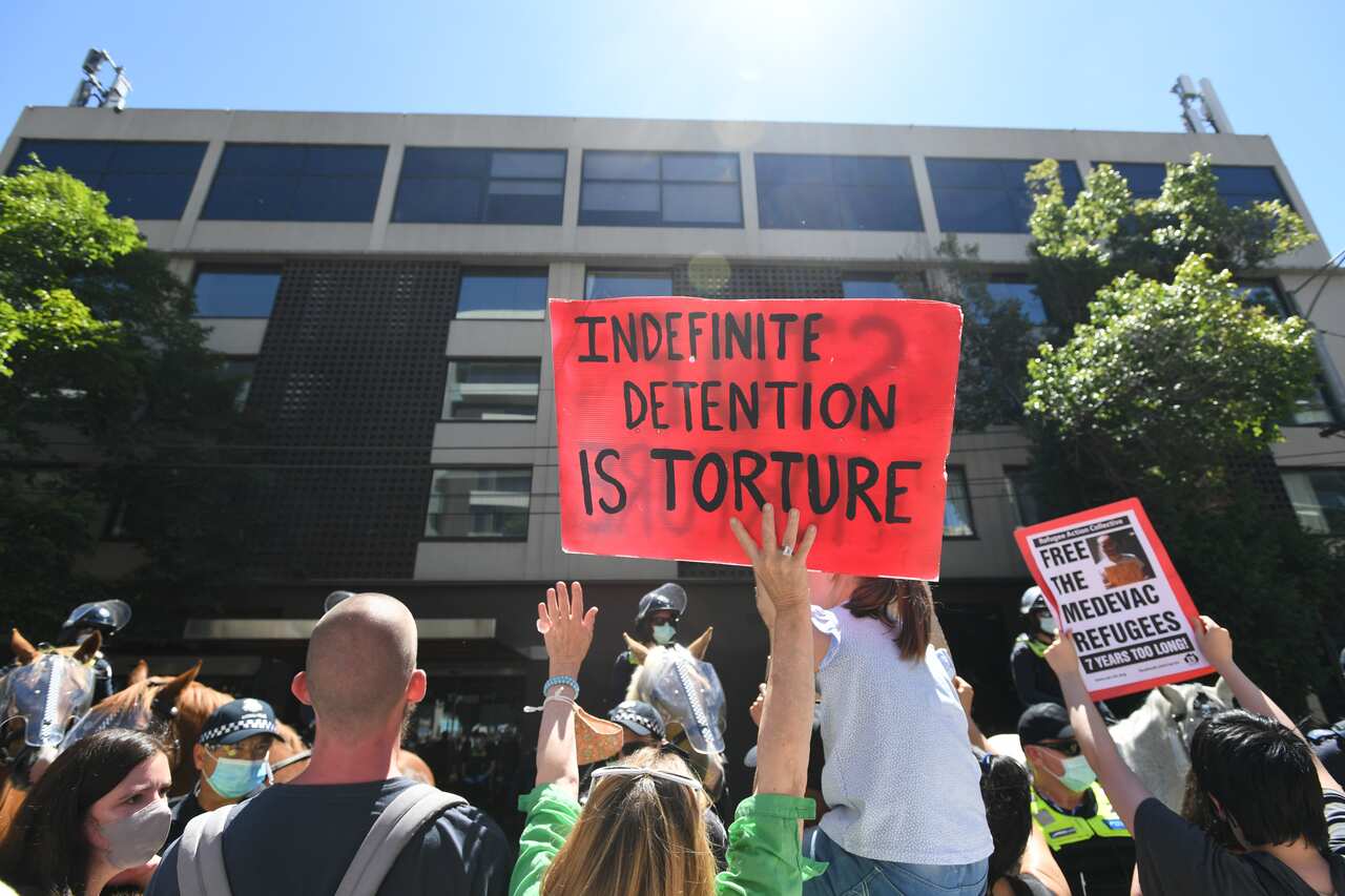 Protesters are seen outside the the Park Hotel in Melbourne, Saturday, January 09, 2021. (AAP Image/Erik Anderson) NO ARCHIVING