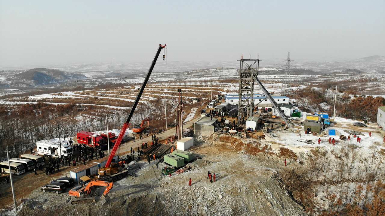In this photo released by China's Xinhua News Agency, rescuers work at the site of the gold mine that suffered an explosion in Qixia on Wednesday, 13 January.