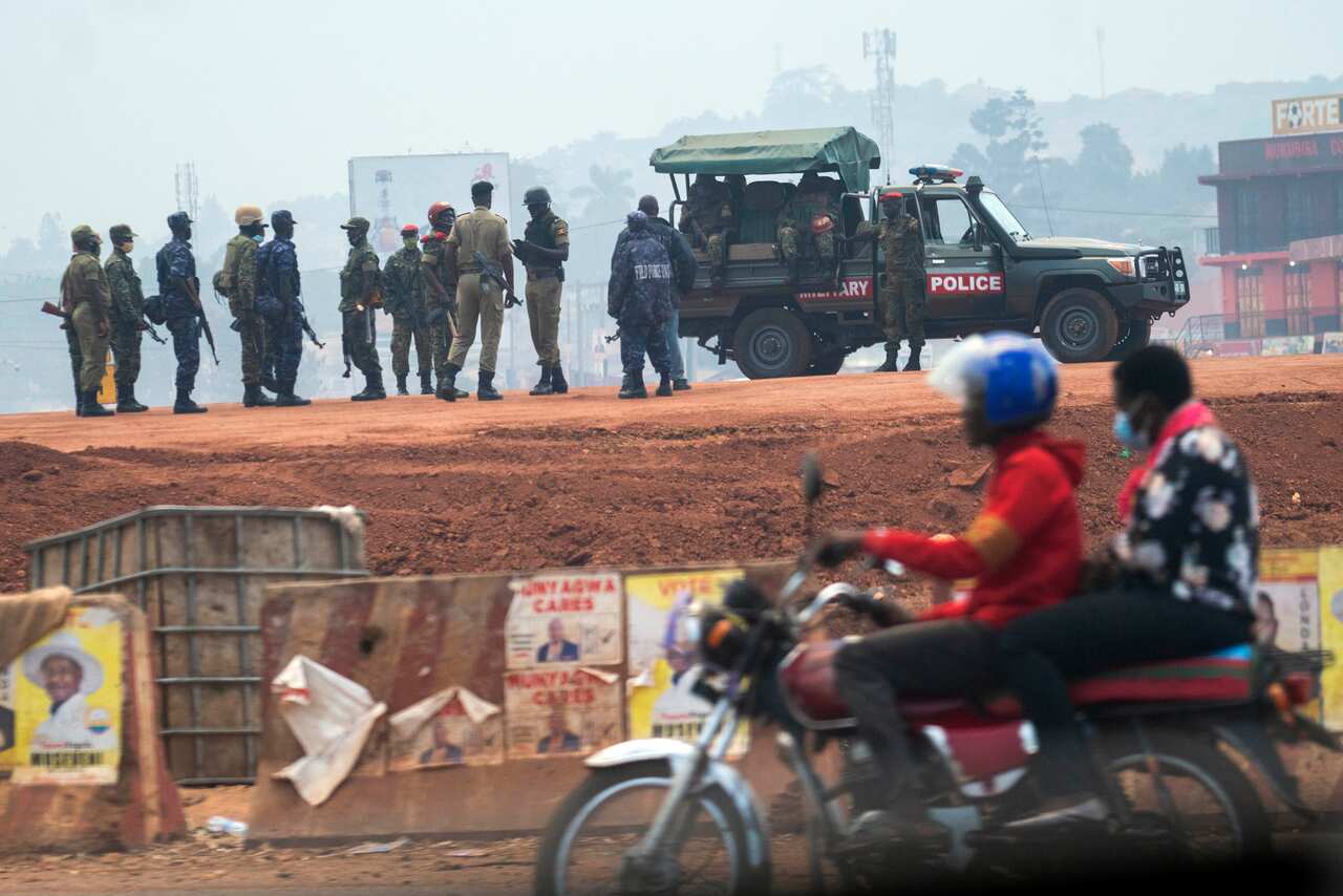 Security forces gather in Kampala, Uganda, Thursday, Jan. 14,  2021.