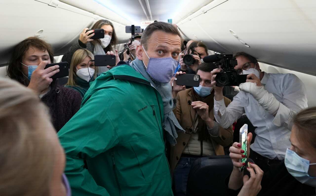 Alexei Navalny is surrounded by journalists prior to his flight to Moscow in the Airport Berlin Brandenburg (BER) in Schoenefeld, Germany, on 17 January.