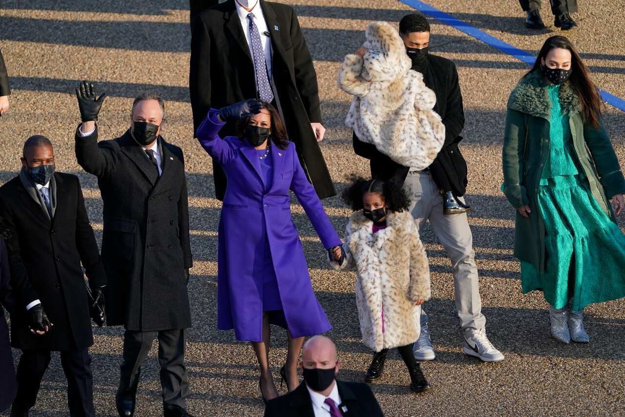 Vice-President Kamala Harris, her husband Doug Emhoff and their family walk in the parade.