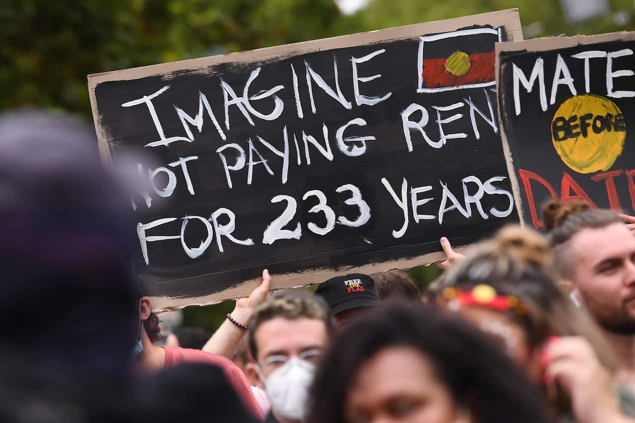 Protesters are seen during an Invasion Day rally in Melbourne.