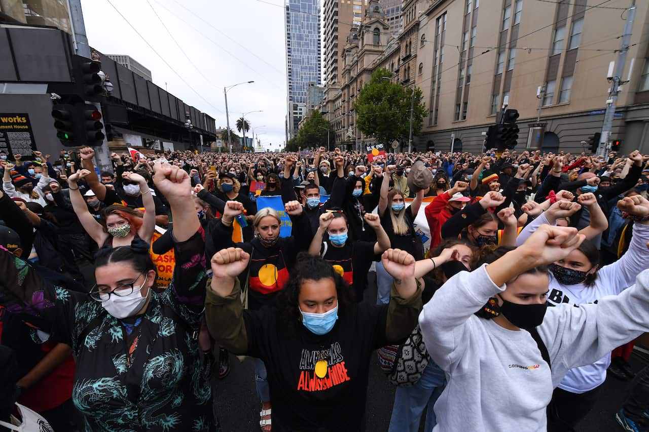 Protesters marched through Melbourne on Tuesday as part of Invasion Day protests.