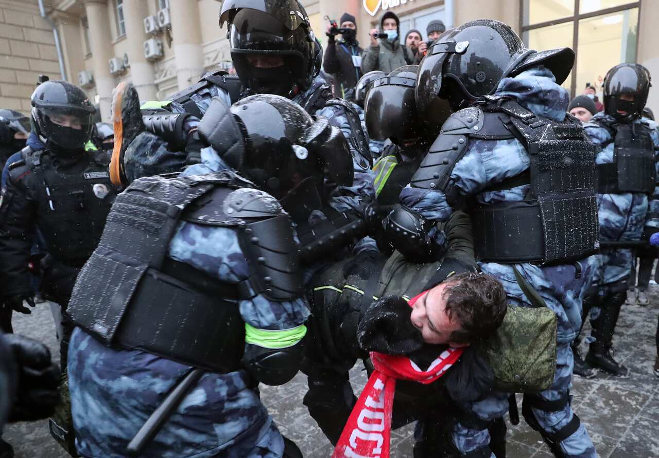 Riot police detain a participant in protest in support of Russian opposition activist Alexei Navalny in central Moscow, 31 January, 2021.
