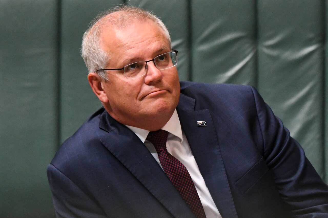 Prime Minister Scott Morrison reacts during  Question Time at Parliament House.