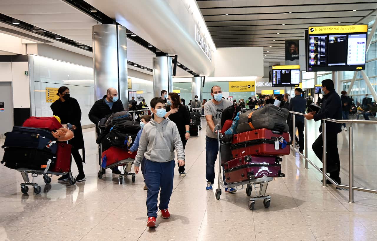 Travellers arrive at Heathrow Airport in London, Britain.