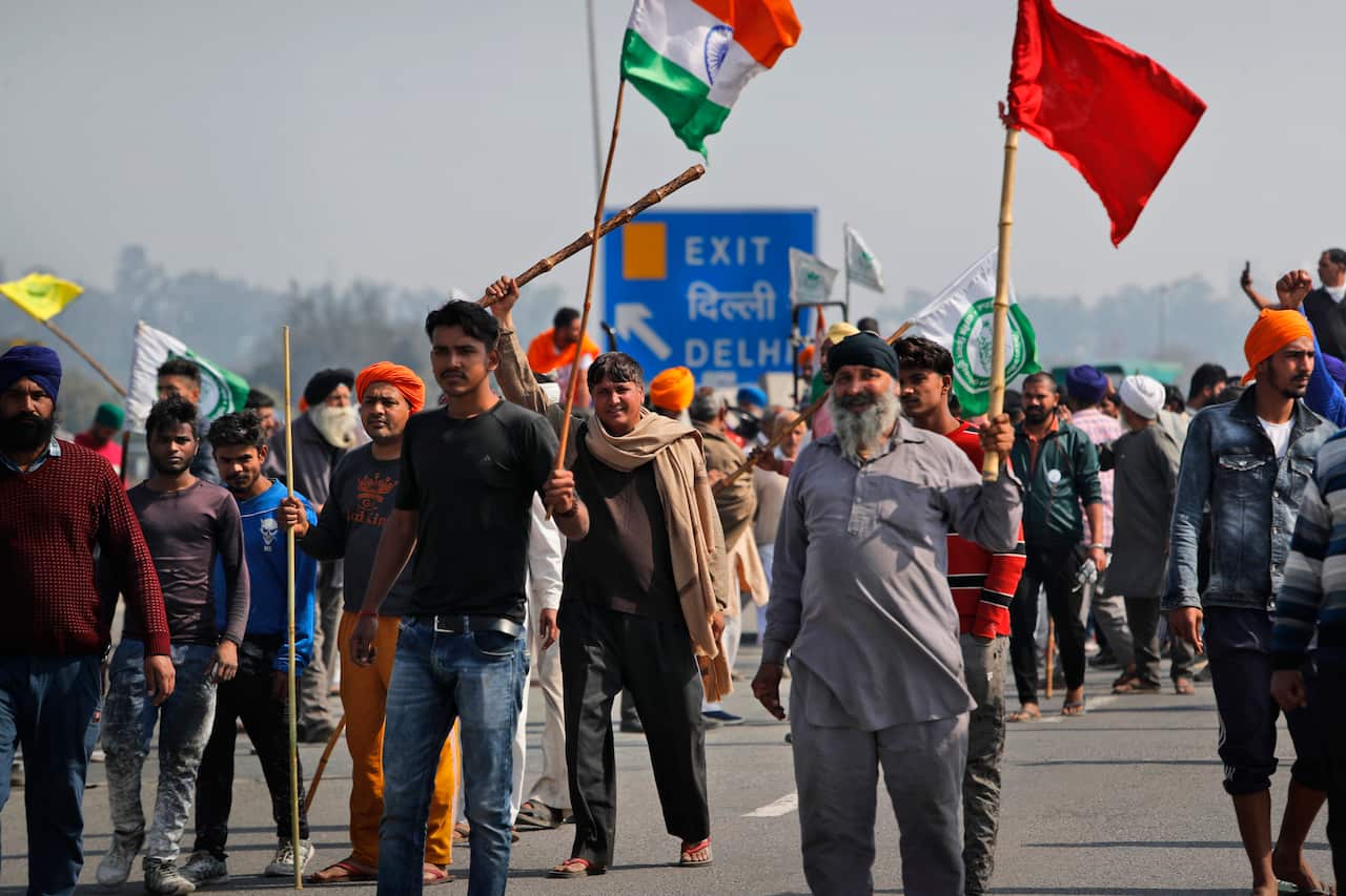 Protesting farmers block an expressway at Kundli in Haryana, Saturday, Feb. 6, 2021.