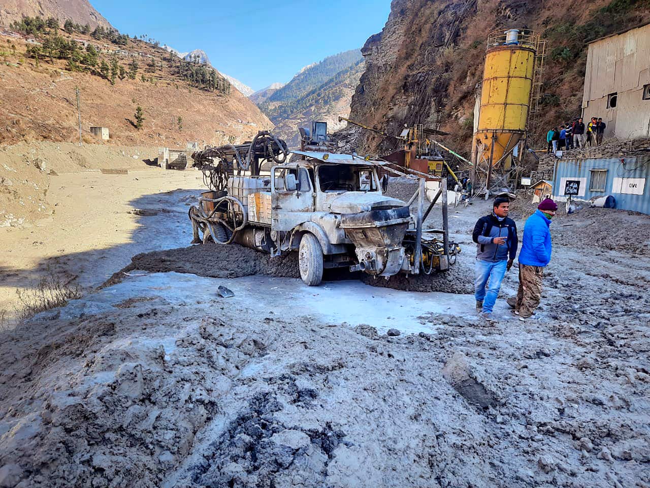 People inspect the site near the damaged Dhauliganga hydropower project at Reni village in Chamoli district after a portion of Nanda Devi glacier broke off.
