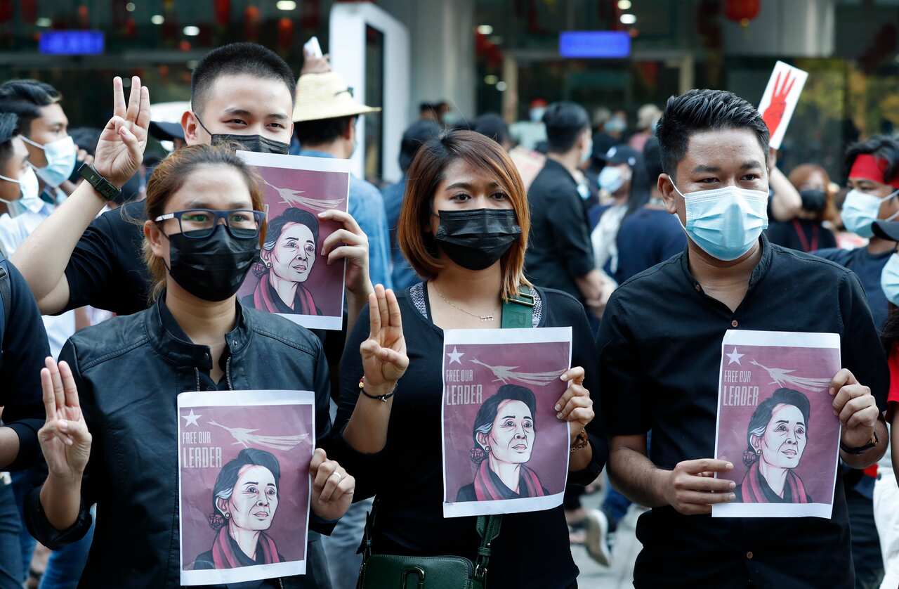 Demonstrators holding placards showing detained democratically-elected leader Aung San Suu Kyi, during a protest against the military coup in Myanmar.
