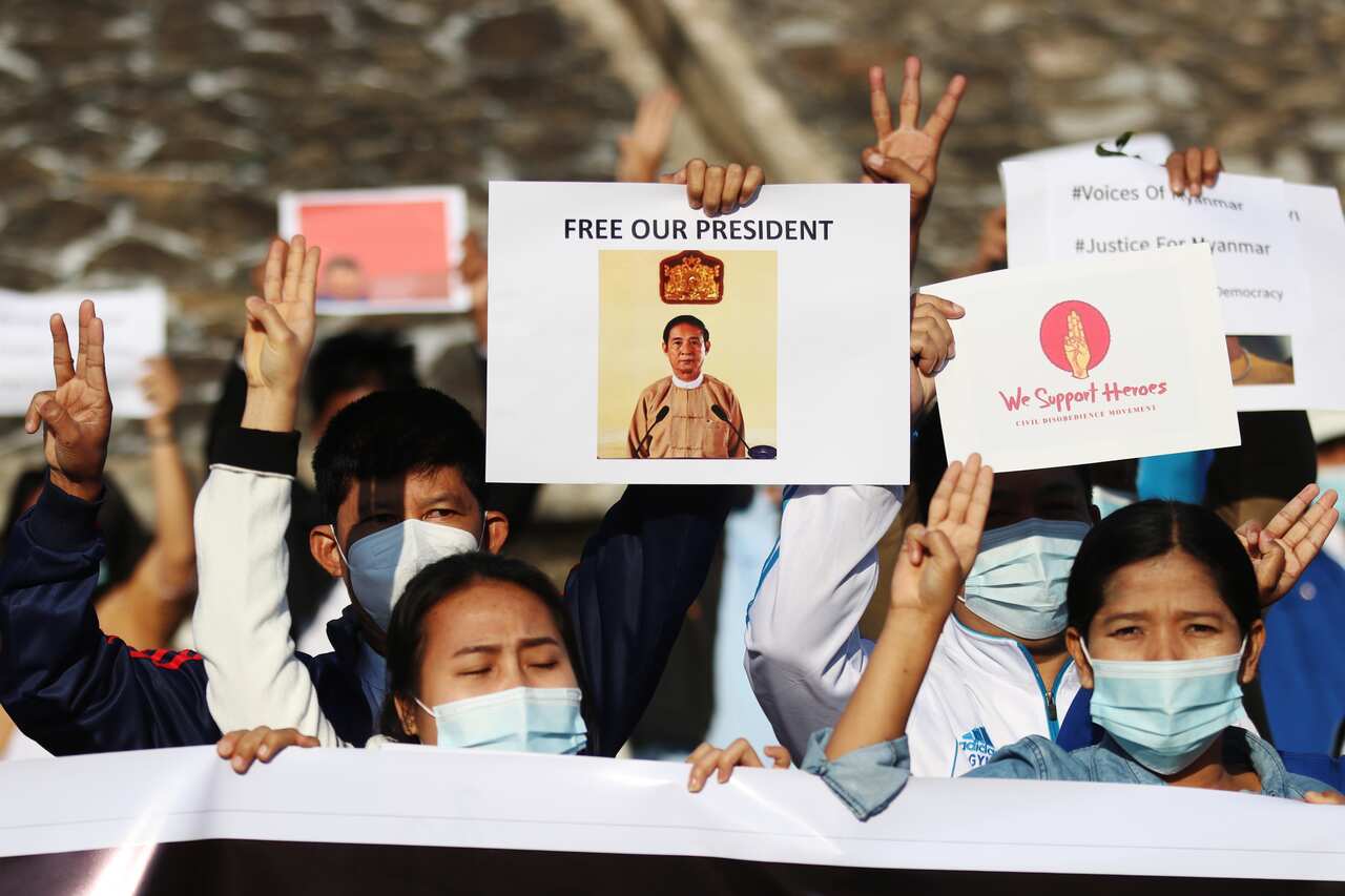 Civil service staff from various ministries flash the defiant three-finger salute during a protest against the military coup in Naypyitaw.