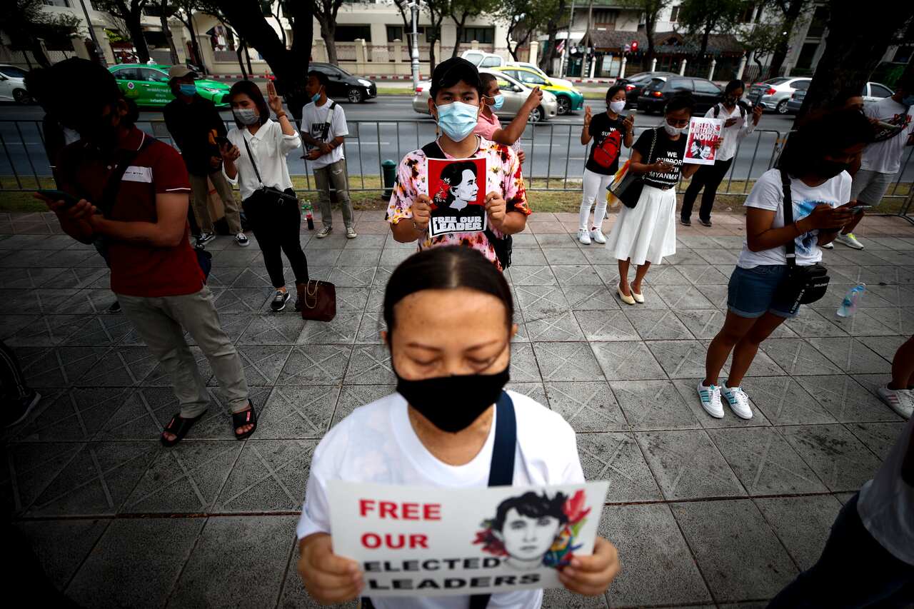 Protesters wore masks and held signs