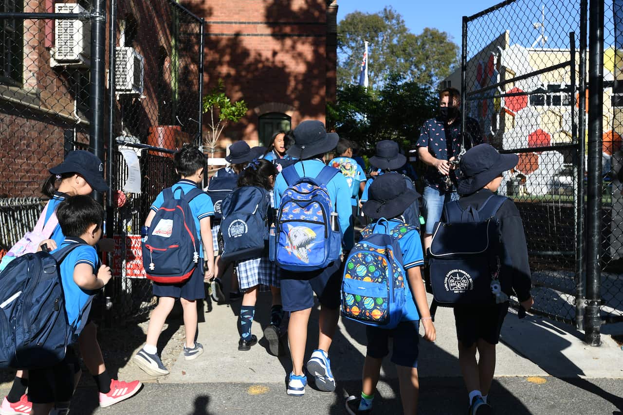 Students arrive at Carlton Gardens Primary School in Melbourne.