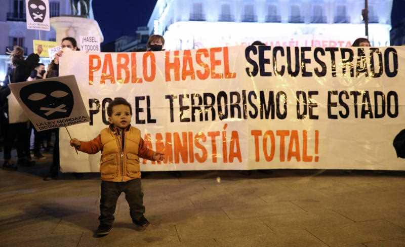 Protesters rally at a plaza in Madrid, Spain.