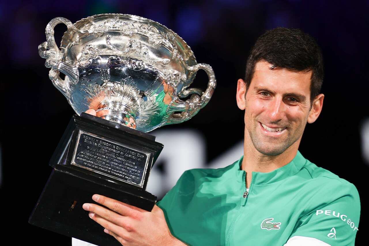 Novak Djokovic celebrates after defeating Daniil Medvedev in the Men's Final match of the Australian Open.