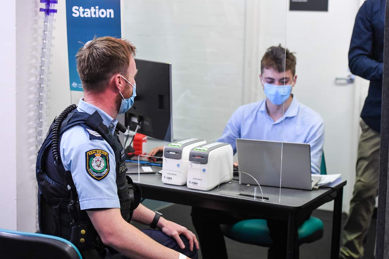 Essential workers including police and medial professionals register at the Royal Prince Alfred Hospital Vaccination Hub in Sydney, Monday, 22 February, 2021. 