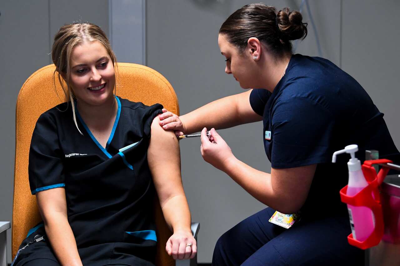 A nurse receiving the Pfizer COVID-19 vaccine at the  in Canberra, Monday, 22 February, 2021. 