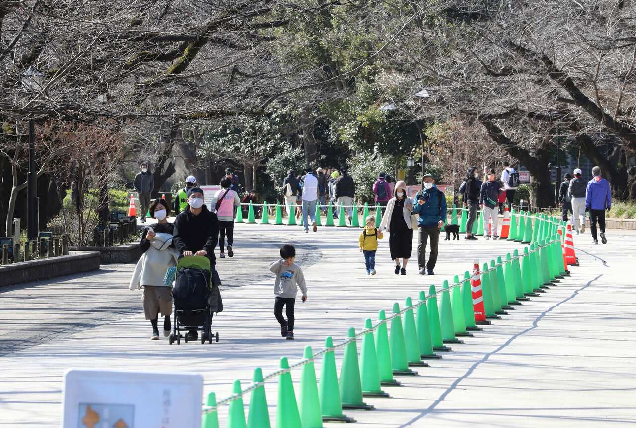 Families walking in Tokyo's Ueno Park on 23 February, 2021.